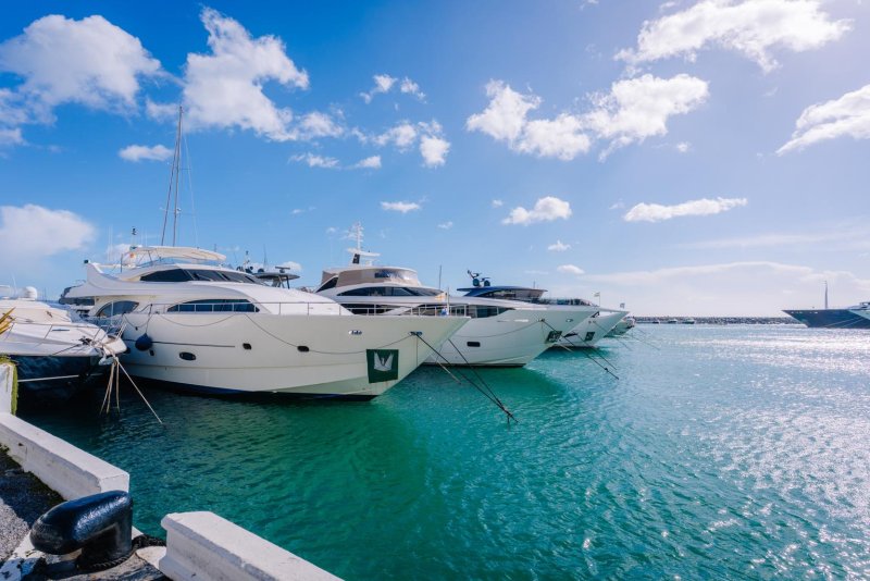 White motor yachts moored in turquoise Mediterranean water